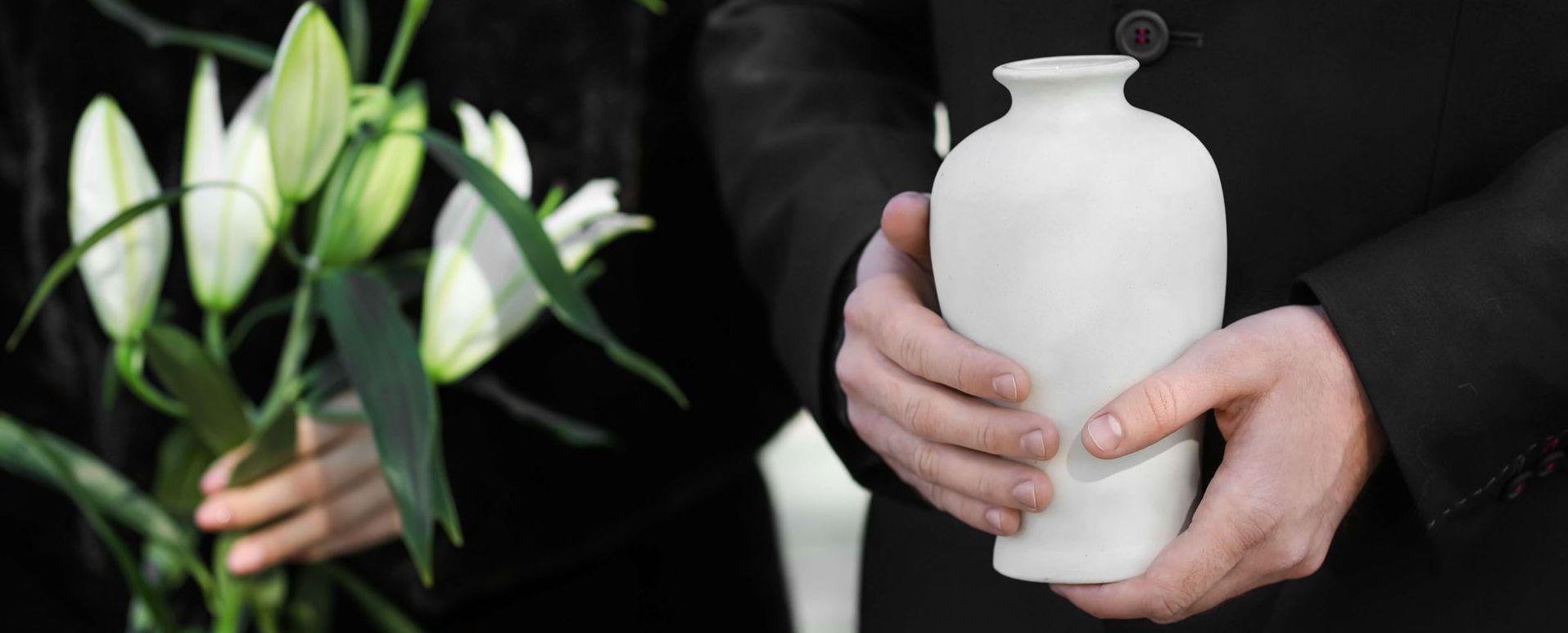 man holding an urn