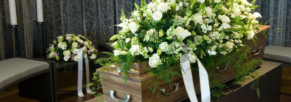 funeral flowers on casket