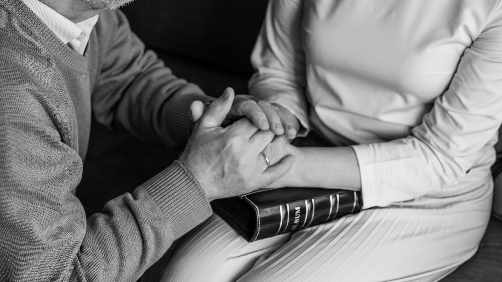 man comforting a woman during grief