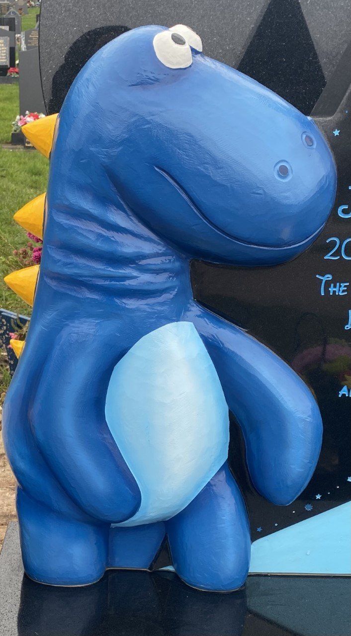 blue dinosaur headstone