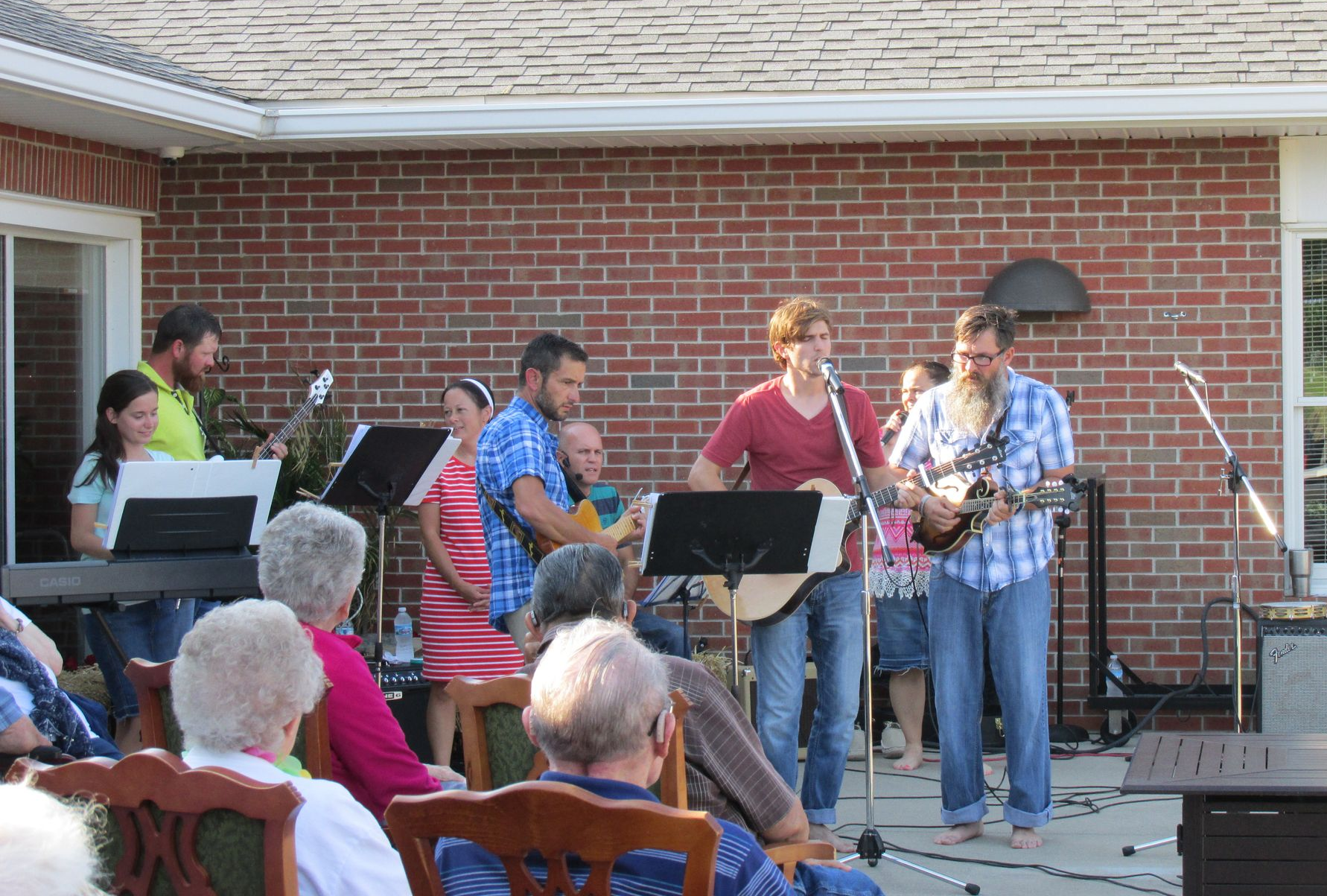 Small apartment with a kitchen, round table and chairs, and two doors.