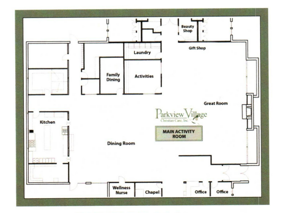 Rainbow arches over a residential area with a brick building and parked cars.