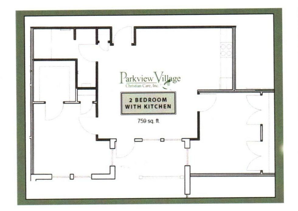 Rainbow arches over a residential area with a brick building and parked cars.
