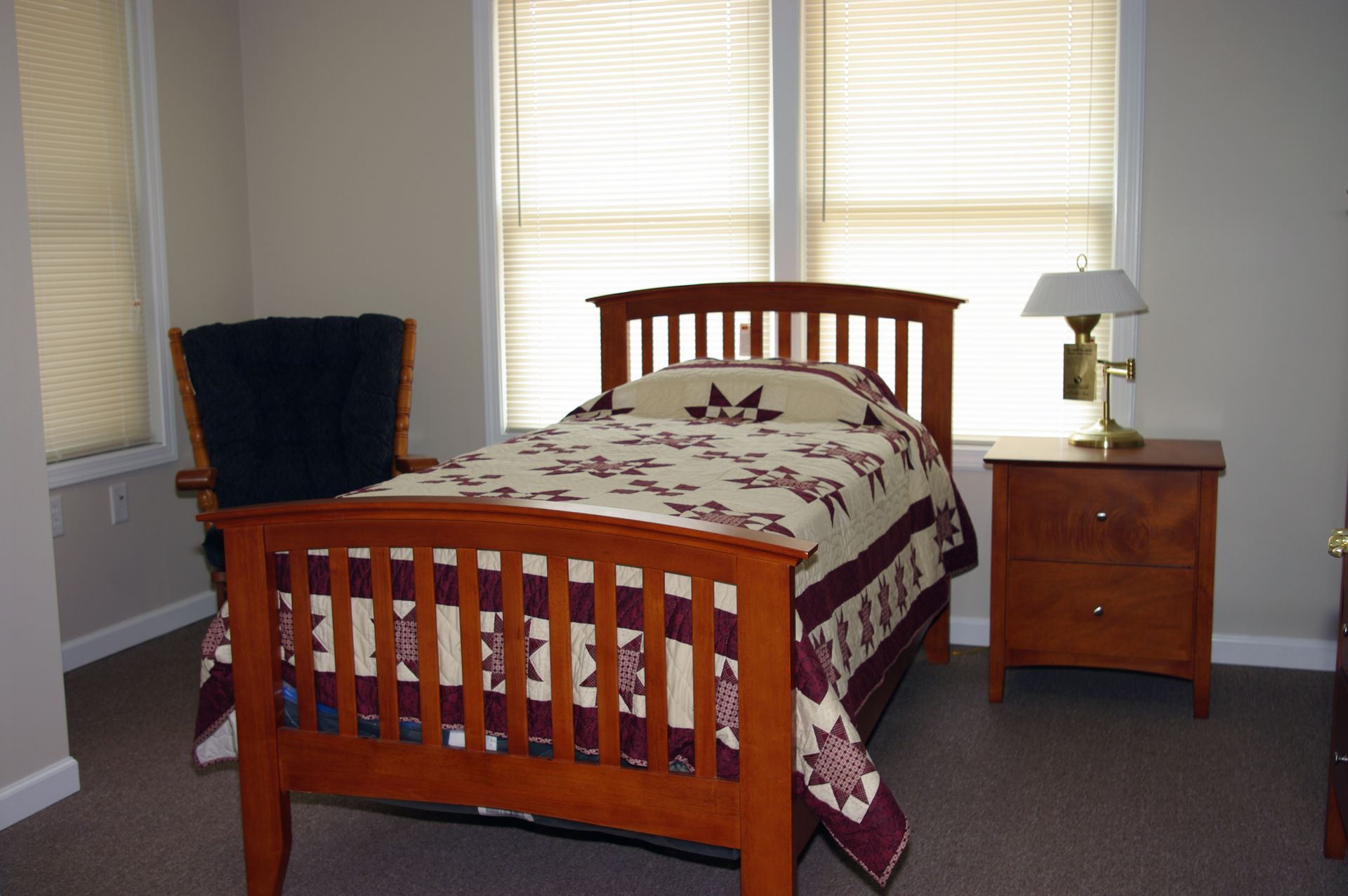 Small apartment with a kitchen, round table and chairs, and two doors.