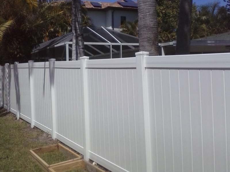 Home Fence Repair — White Fence Side View in Cape Coral, FL