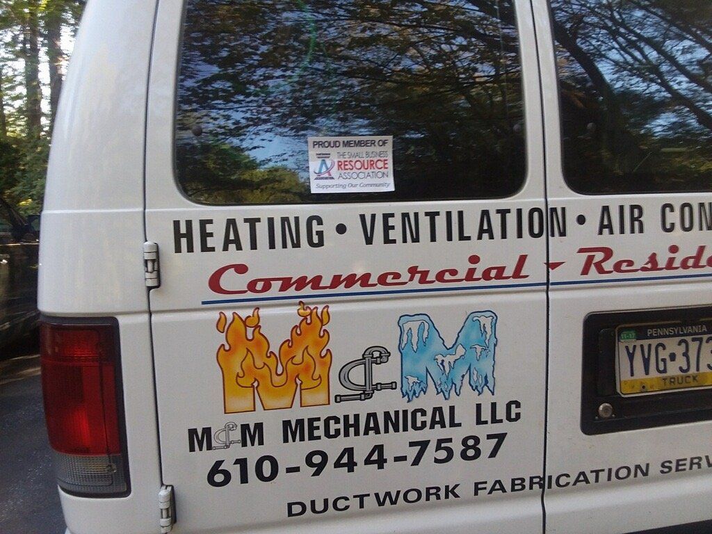 A white van advertises heating ventilation and air conditioning
