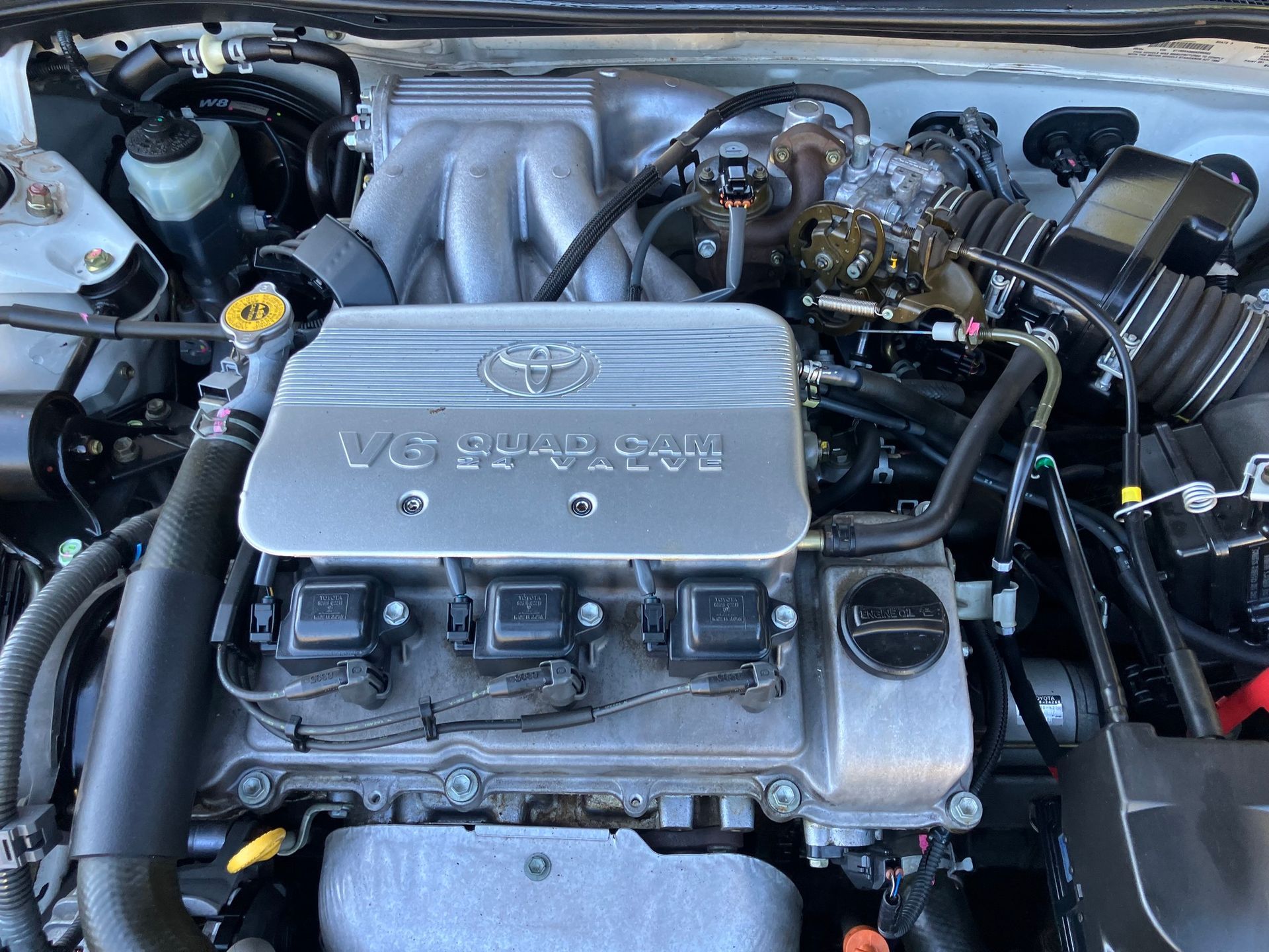 Toyota Engine With Silver Cover and Visible Components — Great Western Auto Wreckers in Orange, NSW