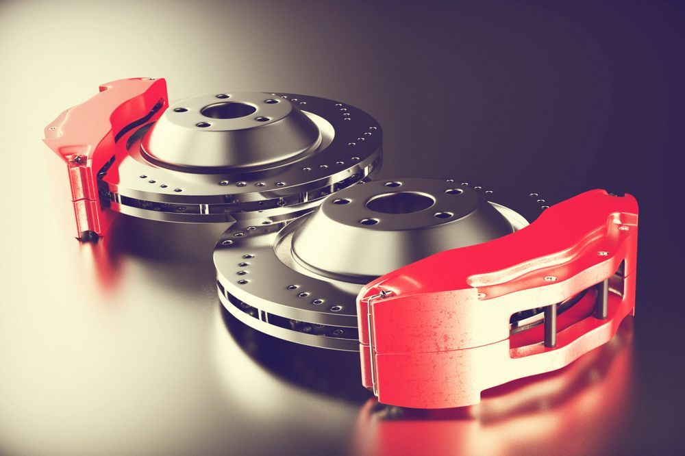 Two Red Brake Calipers With Drilled and Slotted Rotors — Great Western Auto Wreckers in Orange, NSW