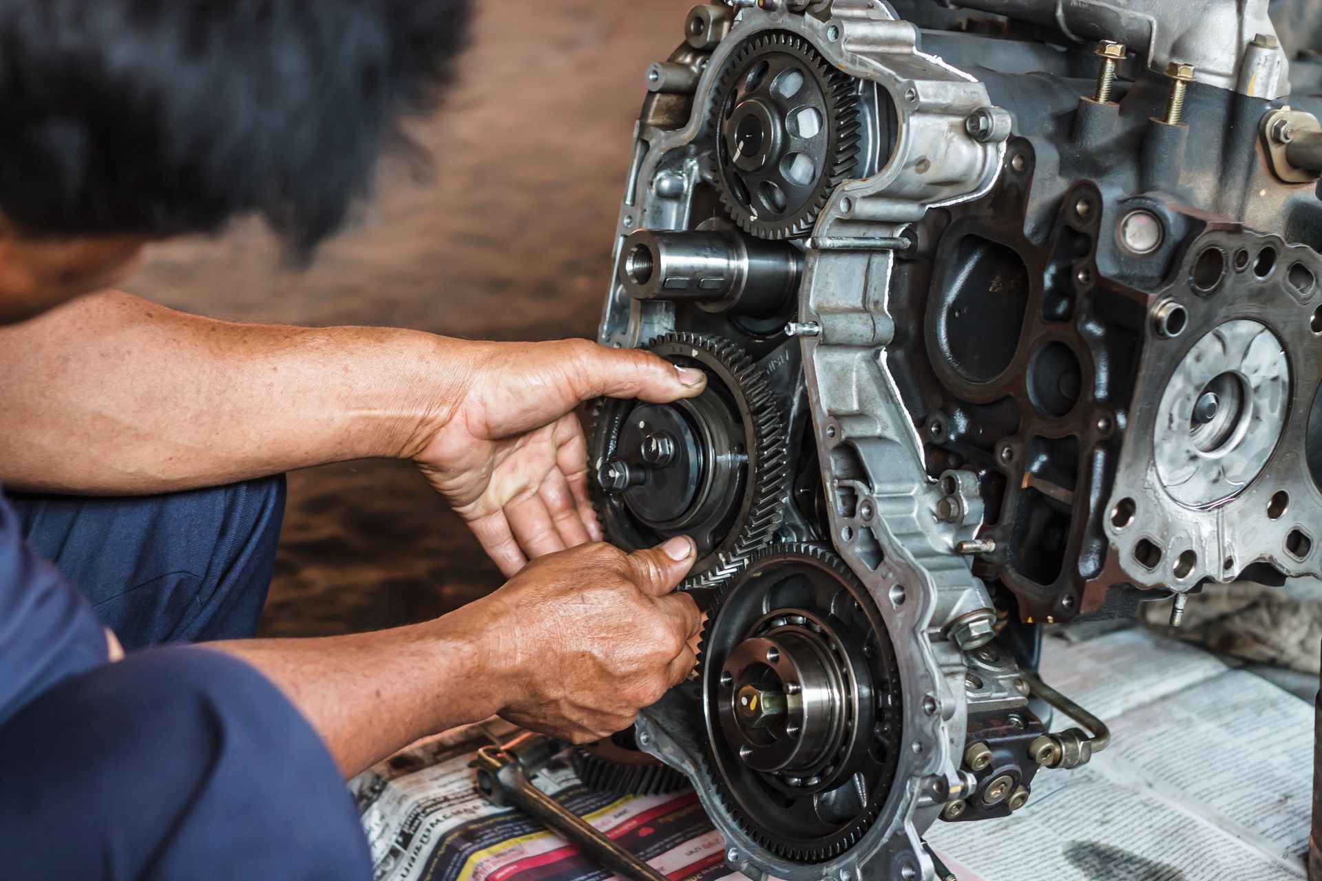 Mechanic's Hands Assembling Gears Inside an Engine Block — Great Western Auto Wreckers in Orange, NSW