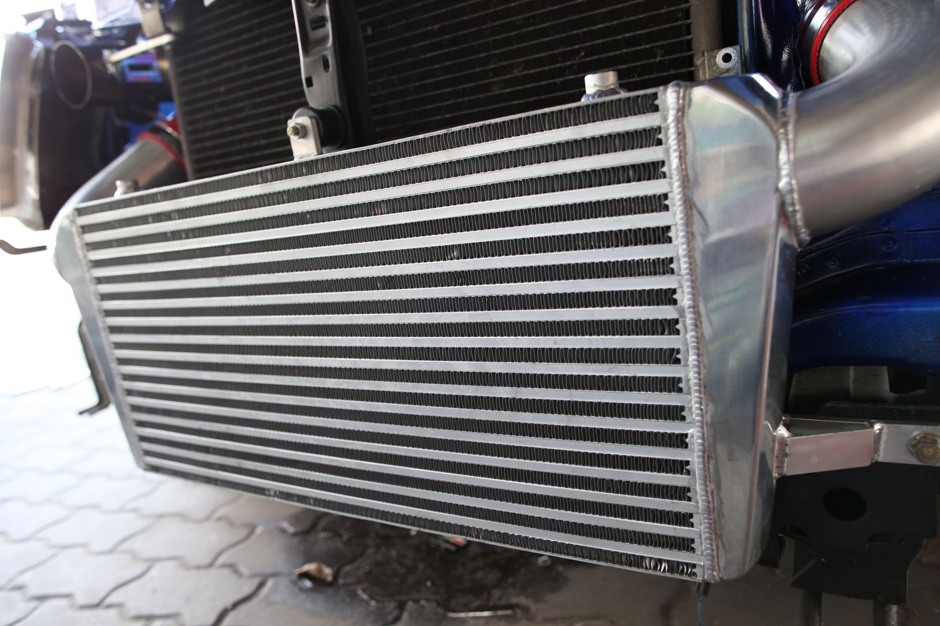 Silver Intercooler Gearbox Radiator Mounted on a Car — Great Western Auto Wreckers in Orange, NSW