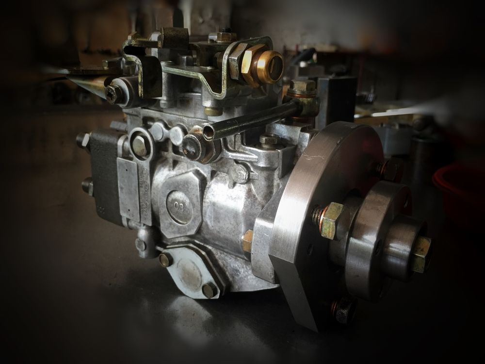 Diesel Fuel Injection Pump With a Silver Finish on a Dark Surface — Great Western Auto Wreckers in Orange, NSW