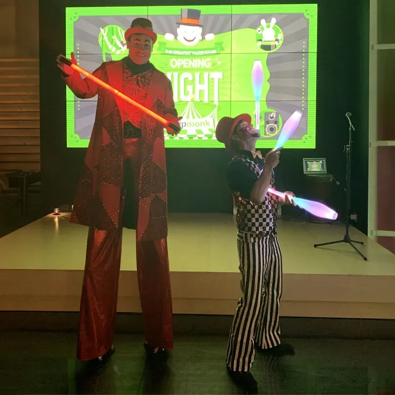 Milanus Circus, Miami, FL, character on stilts and juggler.