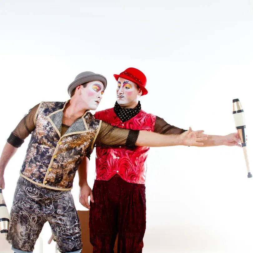 Milanus Circus, Miami, FL, juggling duo in costume.
