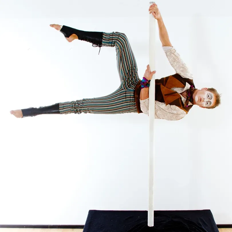 Milanus Circus, Miami, FL, pole performance act.