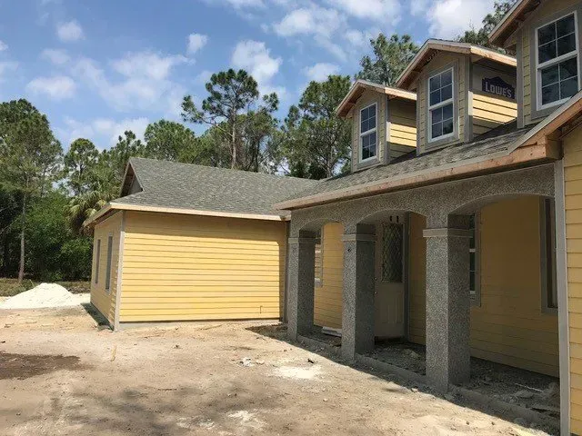Yellow Siding | Cape Coral, Fl | CM Construction & Renovations LLC