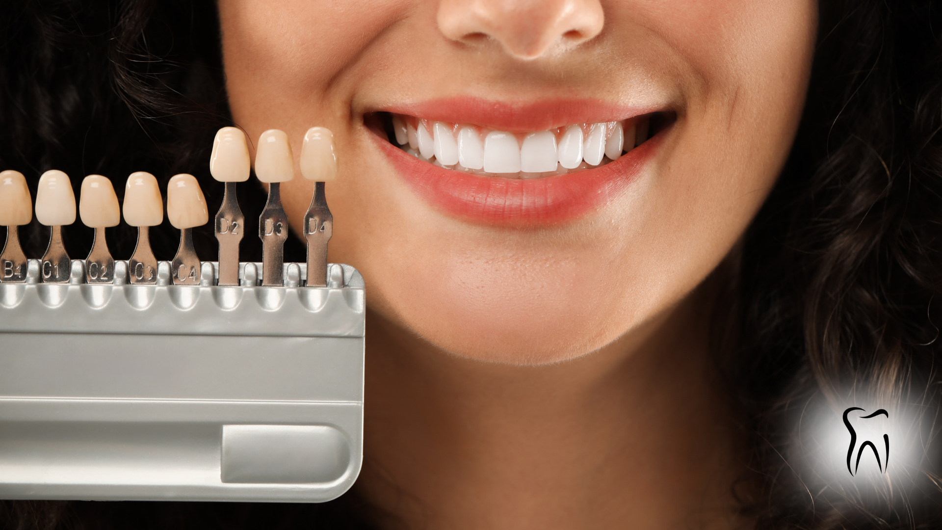 Smiling person with bright white teeth next to a dental shade guide for tooth whitening.