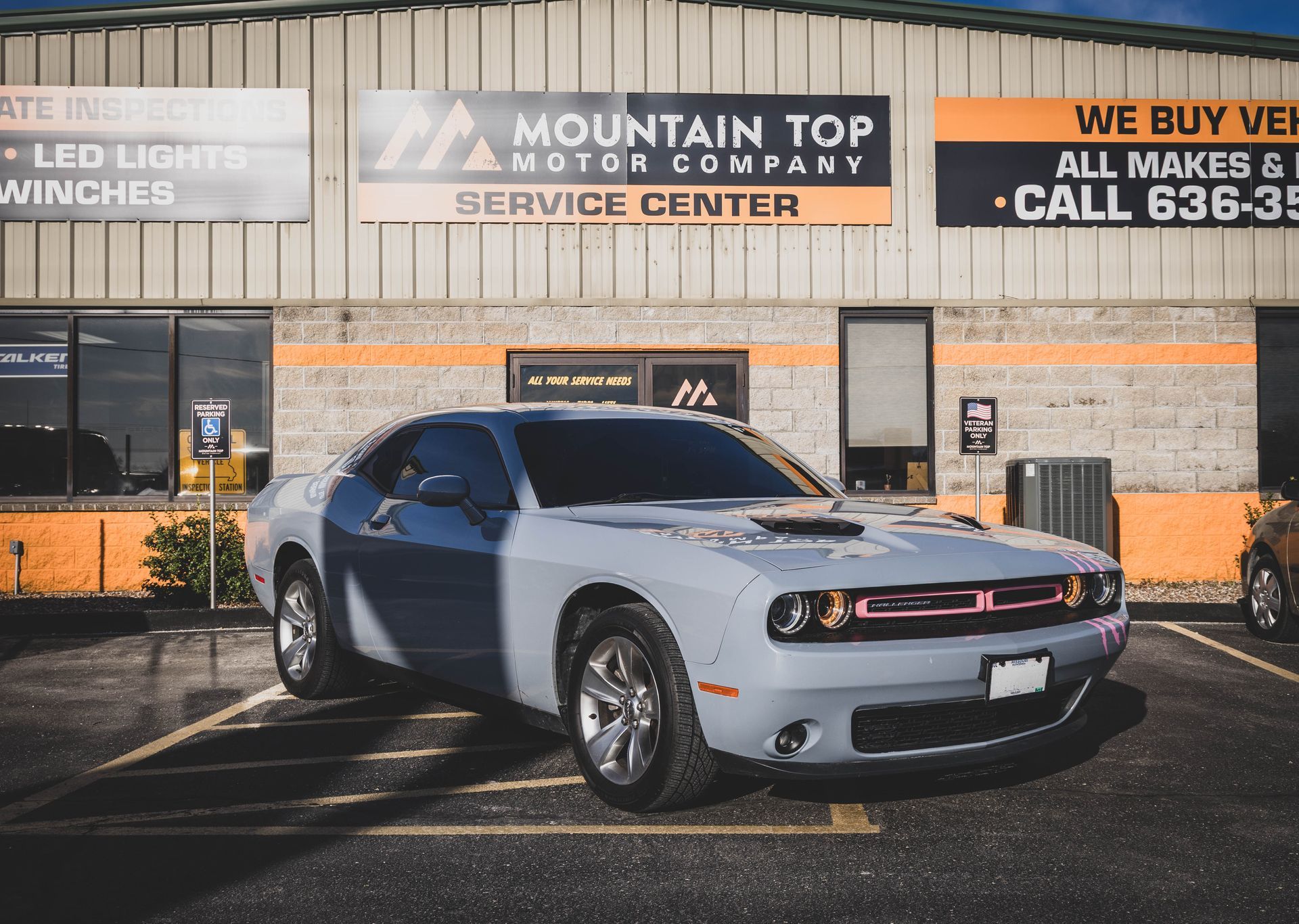 Gray Dodge Challenger parked in front of Mountain Top Motor Company service center. | Mountain Top Service Center