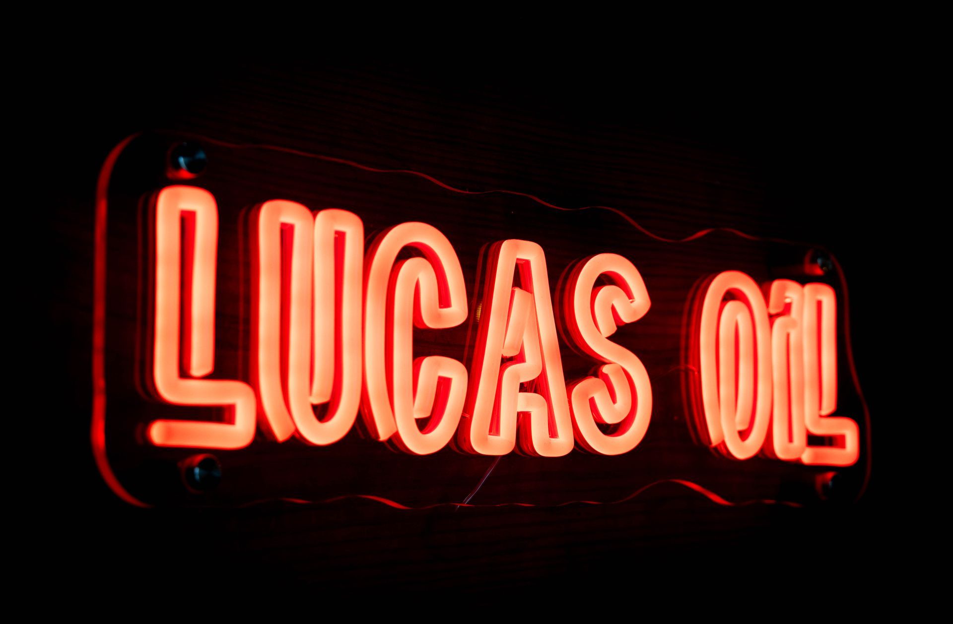 Glowing red neon sign that reads 