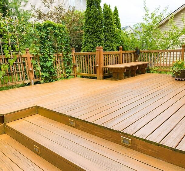 A Wooden Deck With Stairs And A Bench — Chris Stolk Constructions In Corrimal, NSW