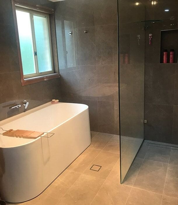 A Bathroom With A Bathtub And A Walk In Shower — Chris Stolk Constructions In Kanahooka, NSW
