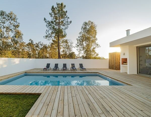 A House With A Swimming Pool And A Wooden Deck — Chris Stolk Constructions In Kanahooka, NSW