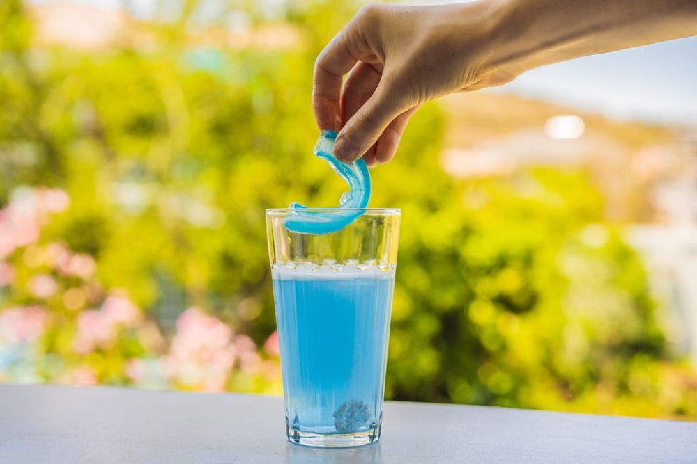 Cleaning a Blue Mouthguard — Bromley's Denture Clinic in Tweed Heads South, NSW