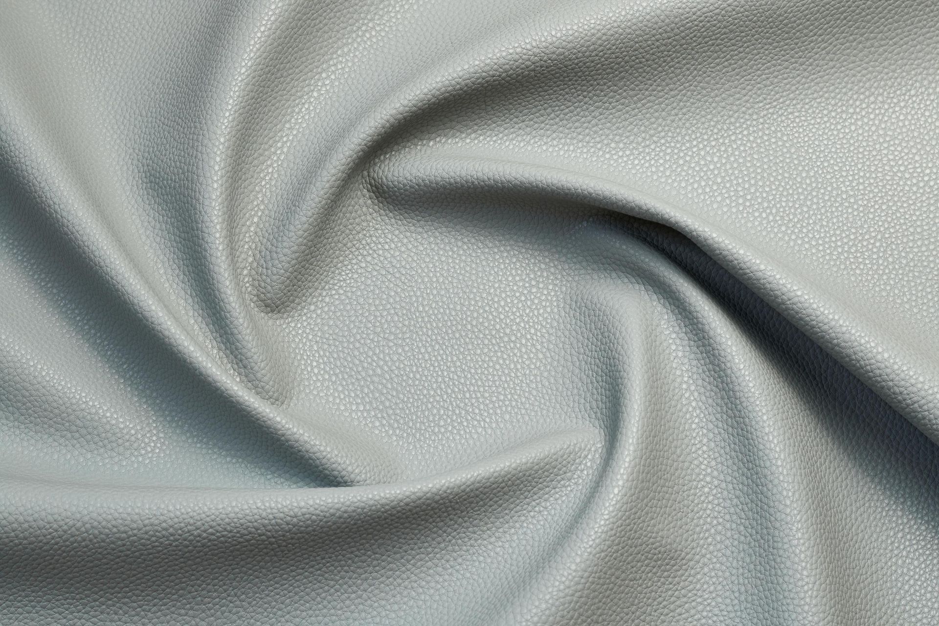 a close up of a piece of fabric that looks like a swirl .