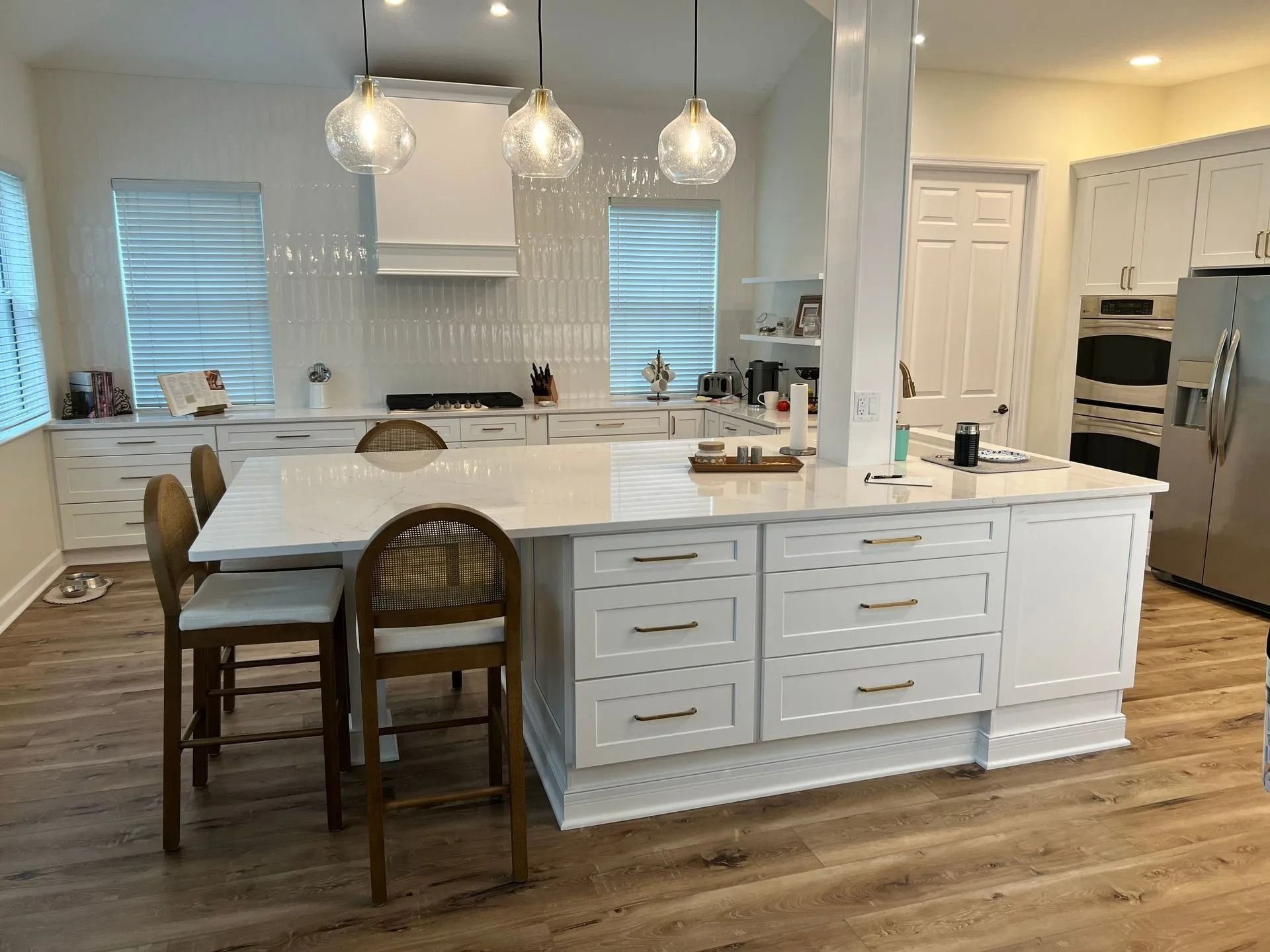 There is a large island in the middle of the kitchen. There is a large island in the middle of the kitchen.