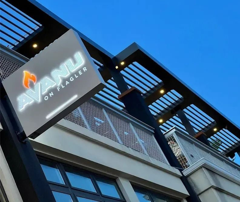 A building with a sign that says avanti on flagler A building with a sign that says avanti on flagler