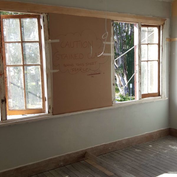 An empty room with window frames in need of repair — Axis Painting in Coffs Harbour, NSW