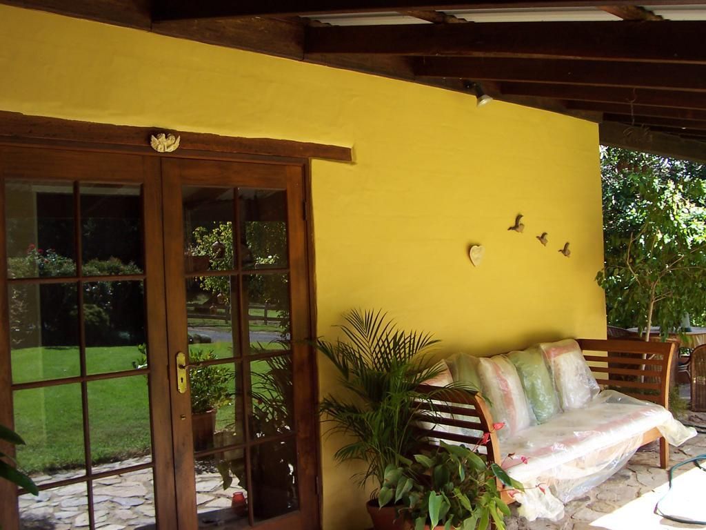 A Porch With a Couch and Birds on the Wall — Axis Painting in Coffs Harbour, NSW