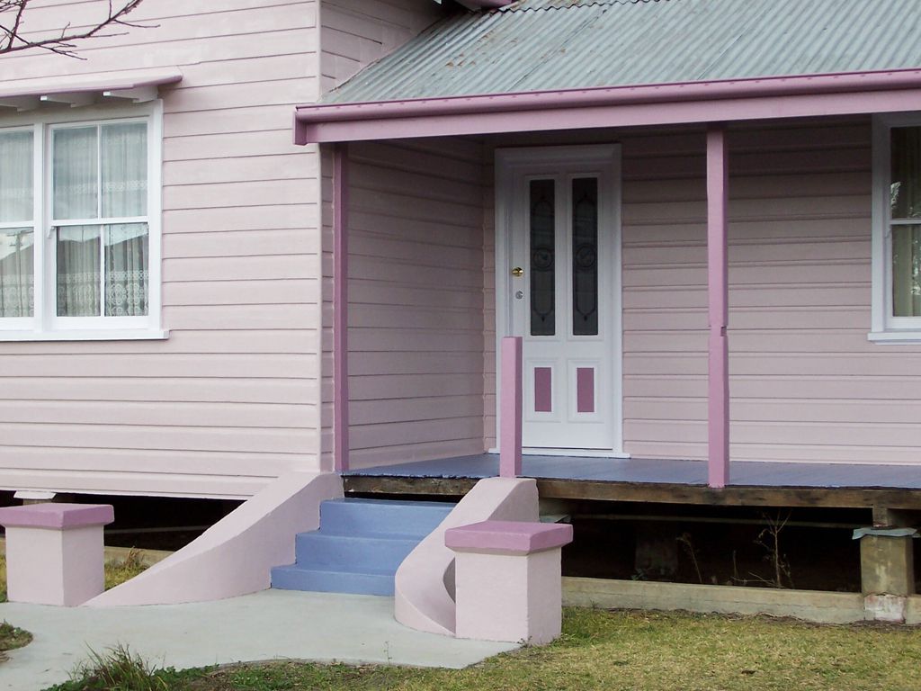 A Pink House With a Porch and Stairs — Axis Painting in Coffs Harbour, NSW