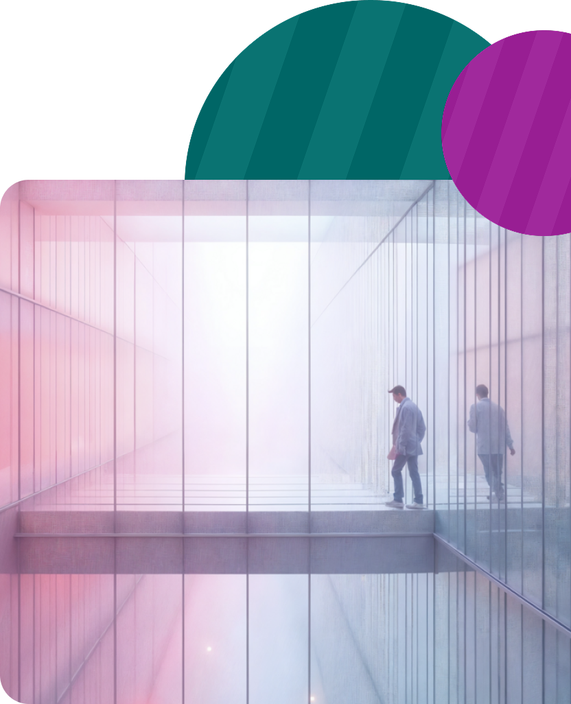 Two people on a glass walkway in a modern pastel-toned building, with large teal and purple circles above.
