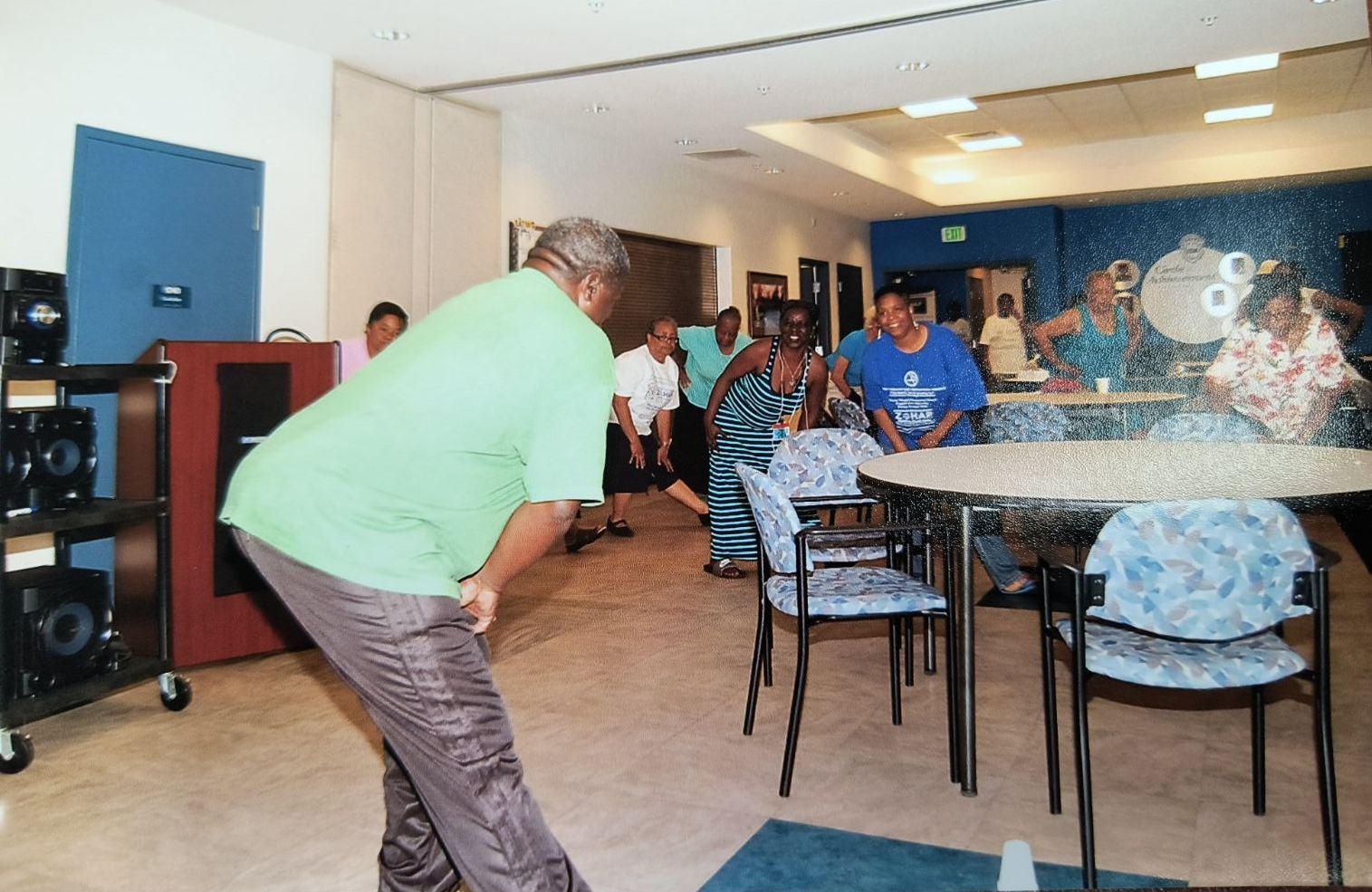 A group of people are playing a game of bowling