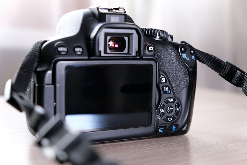 A woman taking a picture with a camera