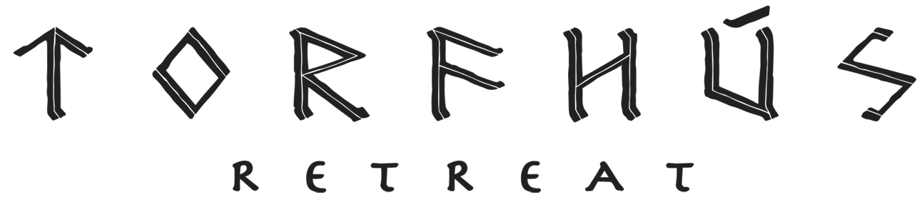 The logo for torfhus retreat is written in runes on a white background.