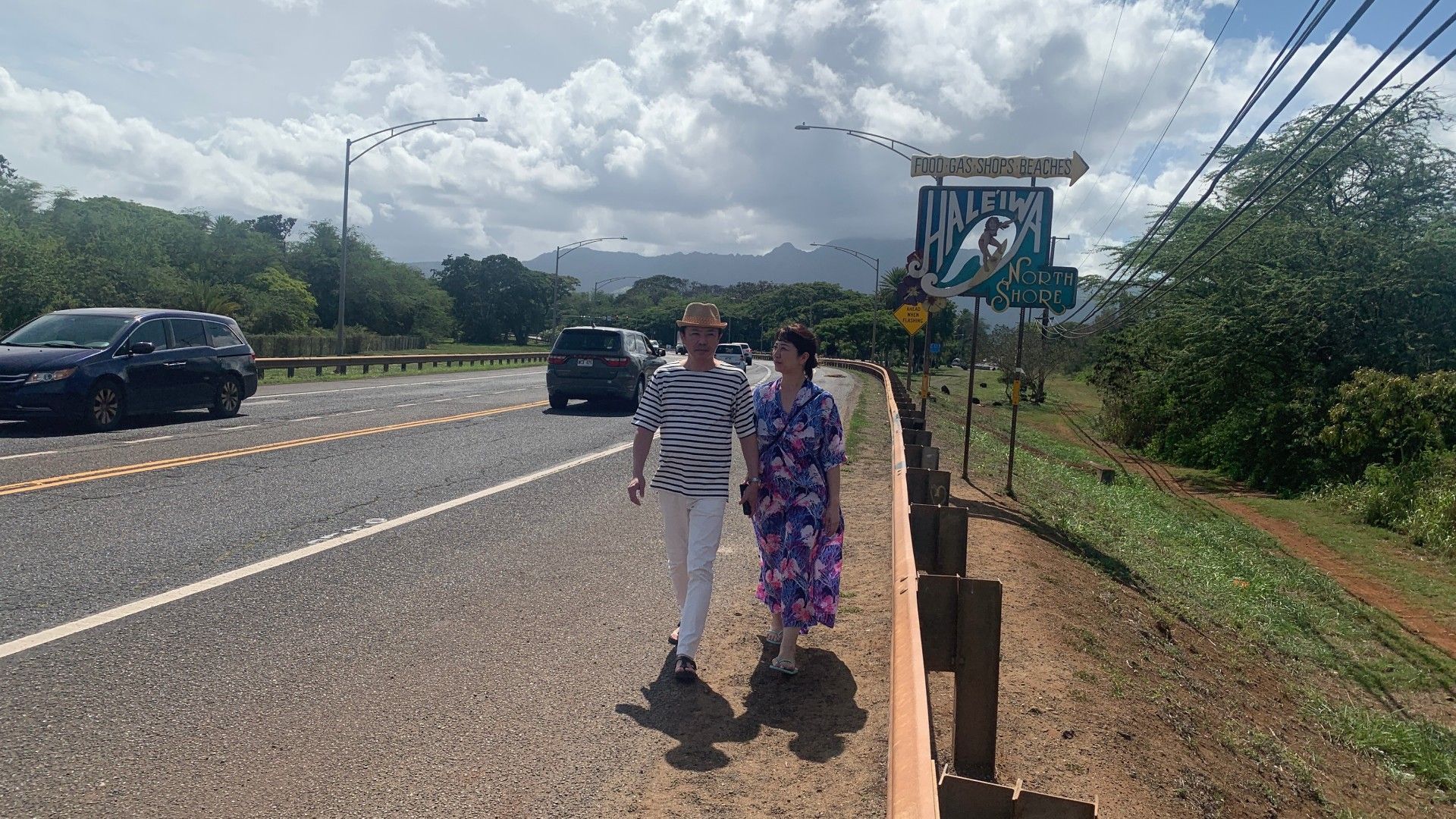 A couple walking at the road