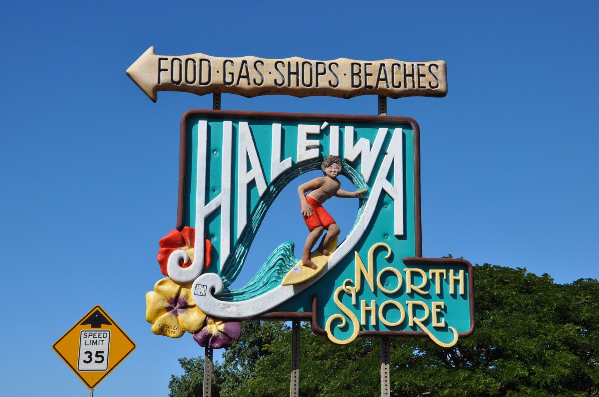 A sign for haleiwa north shore has a surfer on it