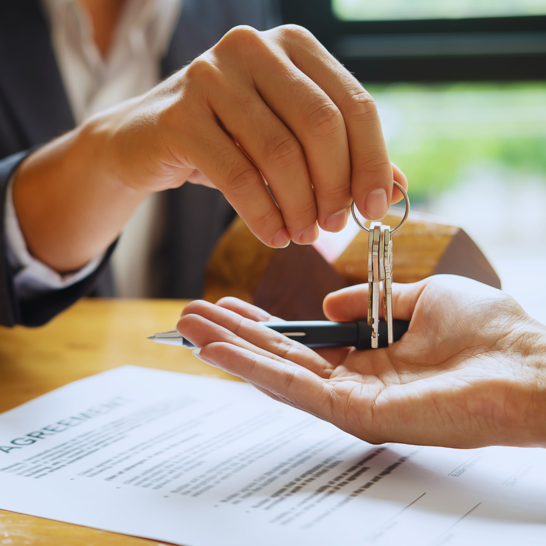 A VNJ Professional Services Notary Signing Agent is handing over keys at a completed mortgage loan closing