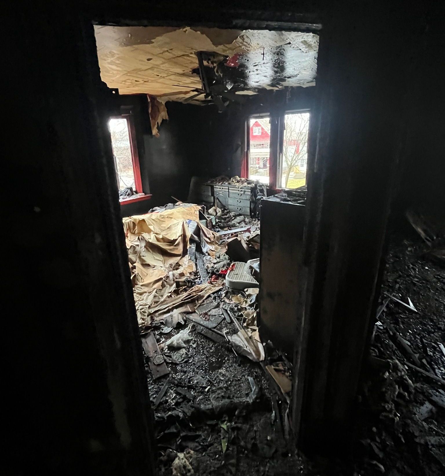 A fire-ravaged bedroom with almost nothing recognizable through the ashes that are left.  This requires a professional restoration company like Unified Restoration Systems