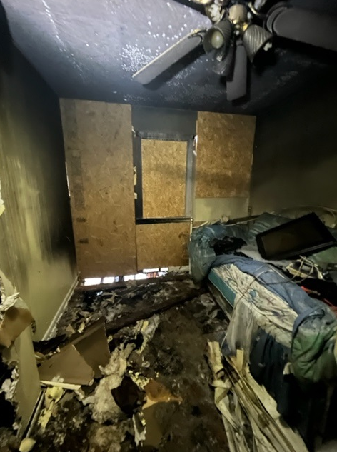 Inside bedroom view of a severely flame damage house.  It was completely destroyed