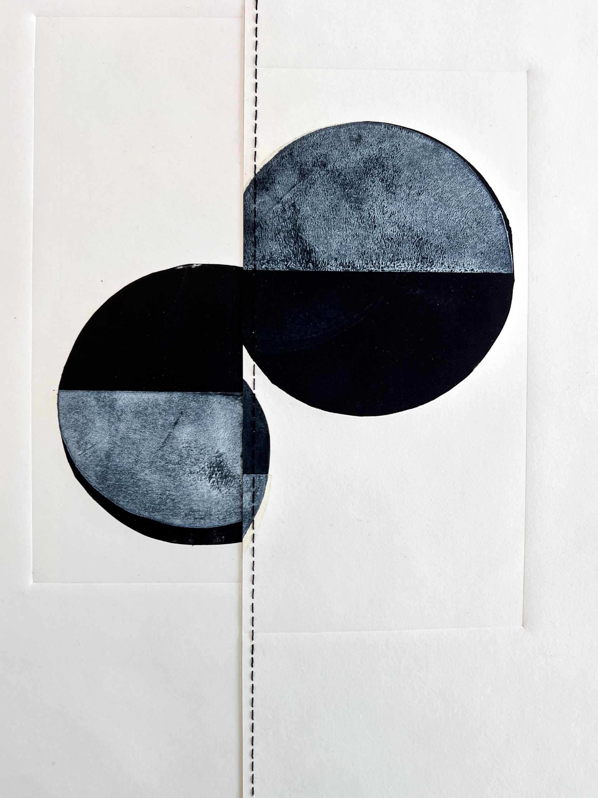 Abstract geometric print with overlapping black and blue-gray semicircles on a white background
