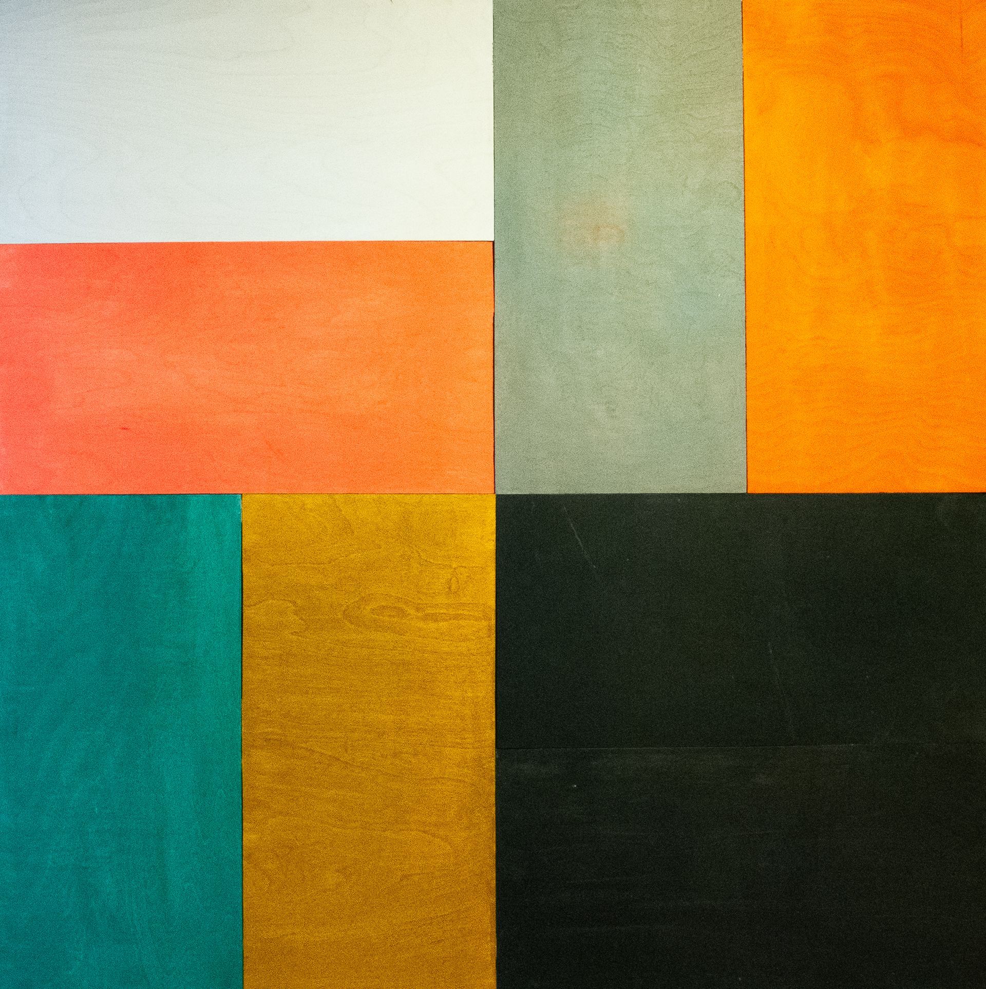 Abstract composition of textured color blocks in orange, teal, green, yellow, white, and black.