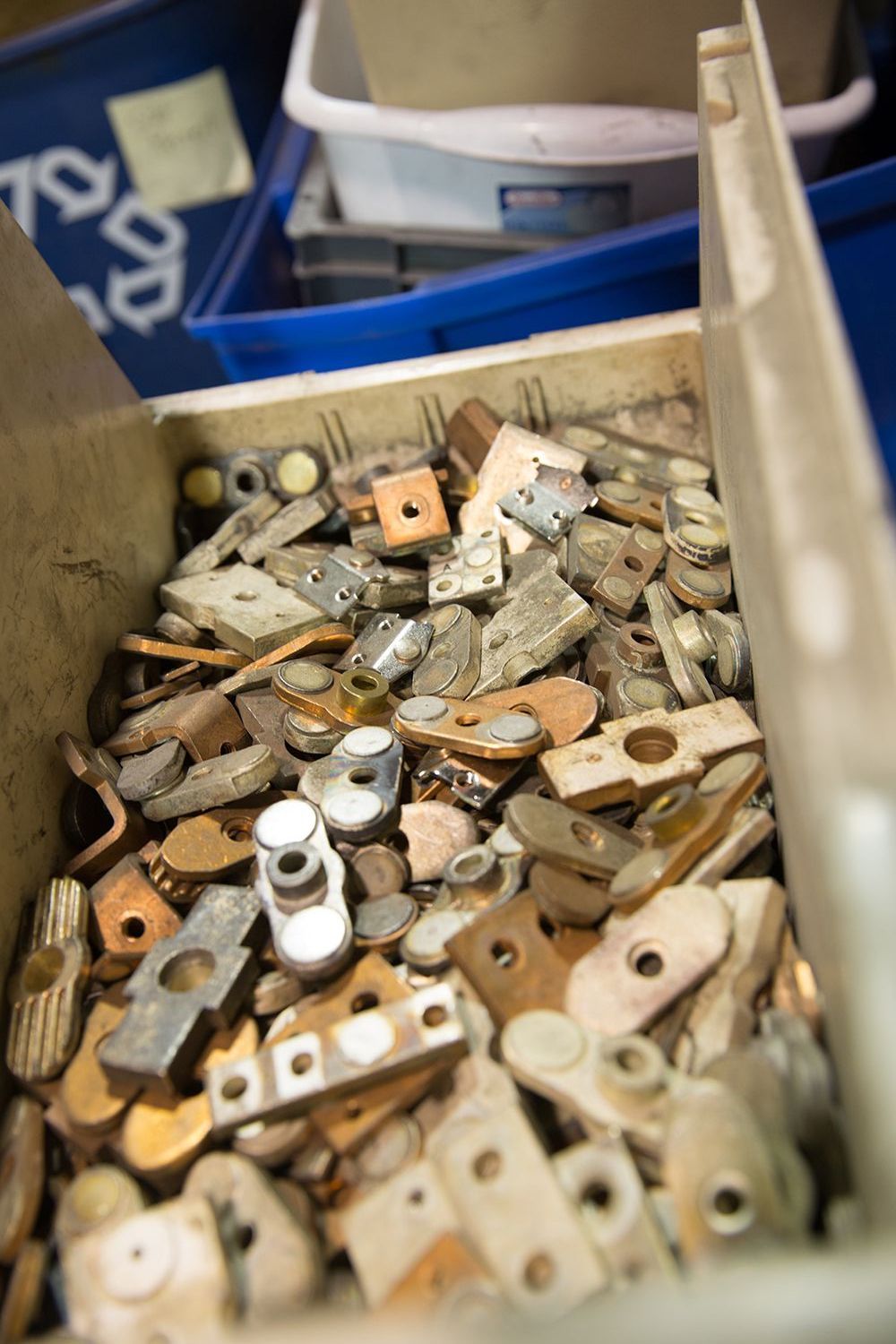 A box filled with a bunch of pieces of metal