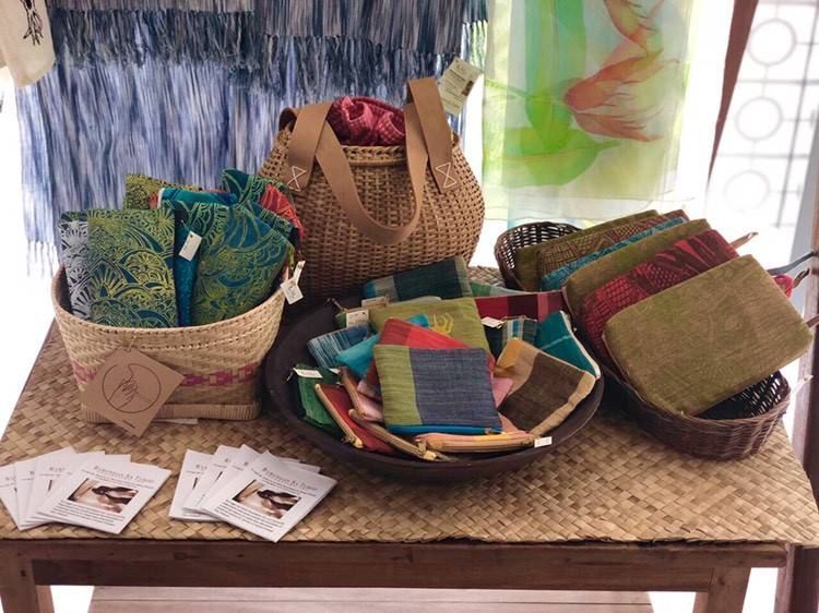 A table with a basket and wallets locally made in Palawan