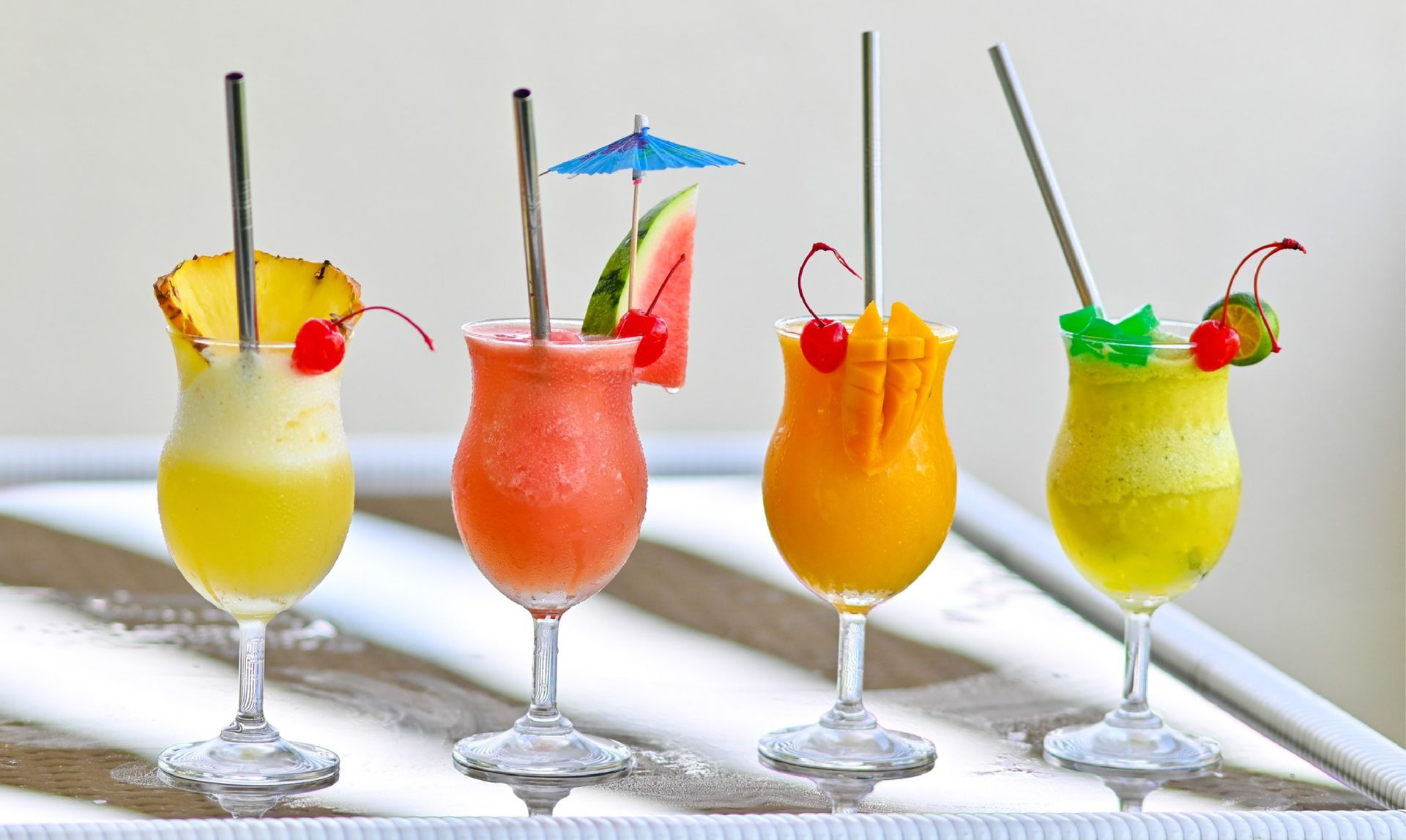 Tropical fruit smoothies at best Puerto Princesa hotel with pineapple, watermelon, mango, and melon garnished with cherries.