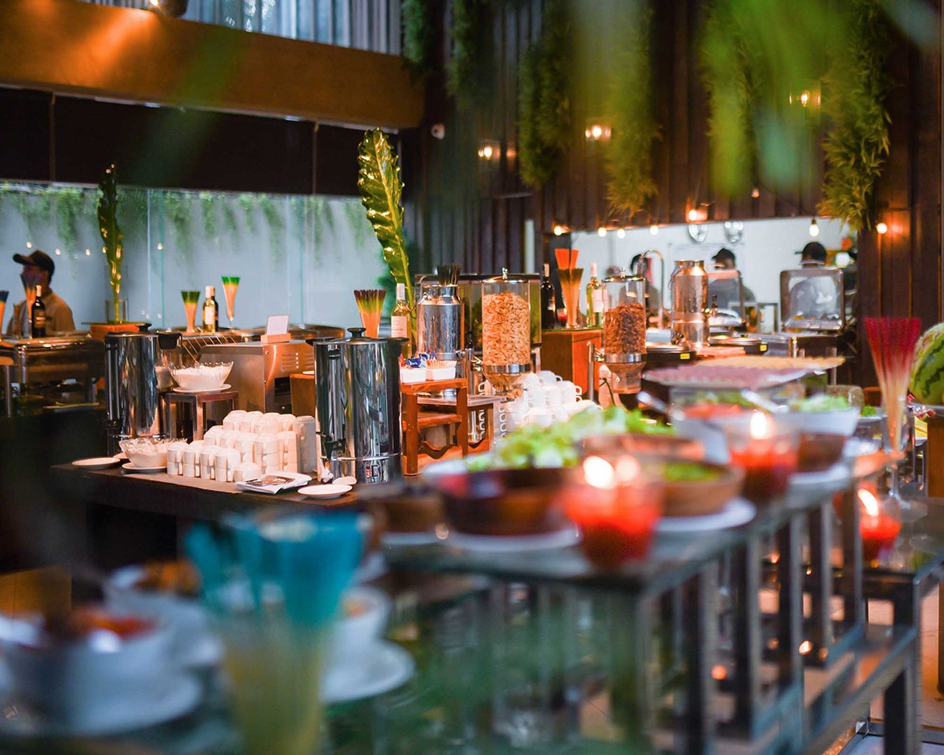 A buffet with a lot of food and candles in a Boracay restaurant.