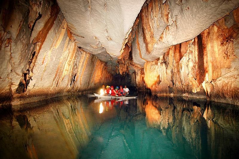 A group of people are in a boat in Puerto Princesa Subterranean River  