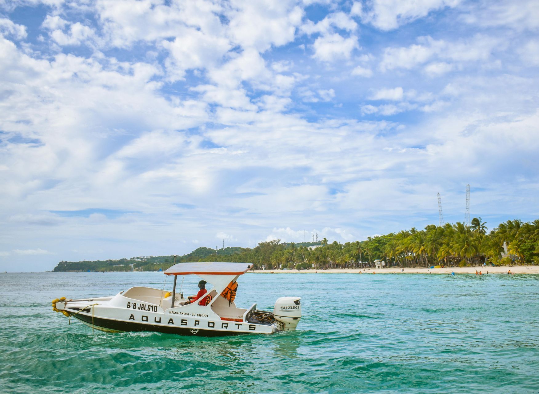 A boat is floating on top of Boracay's water