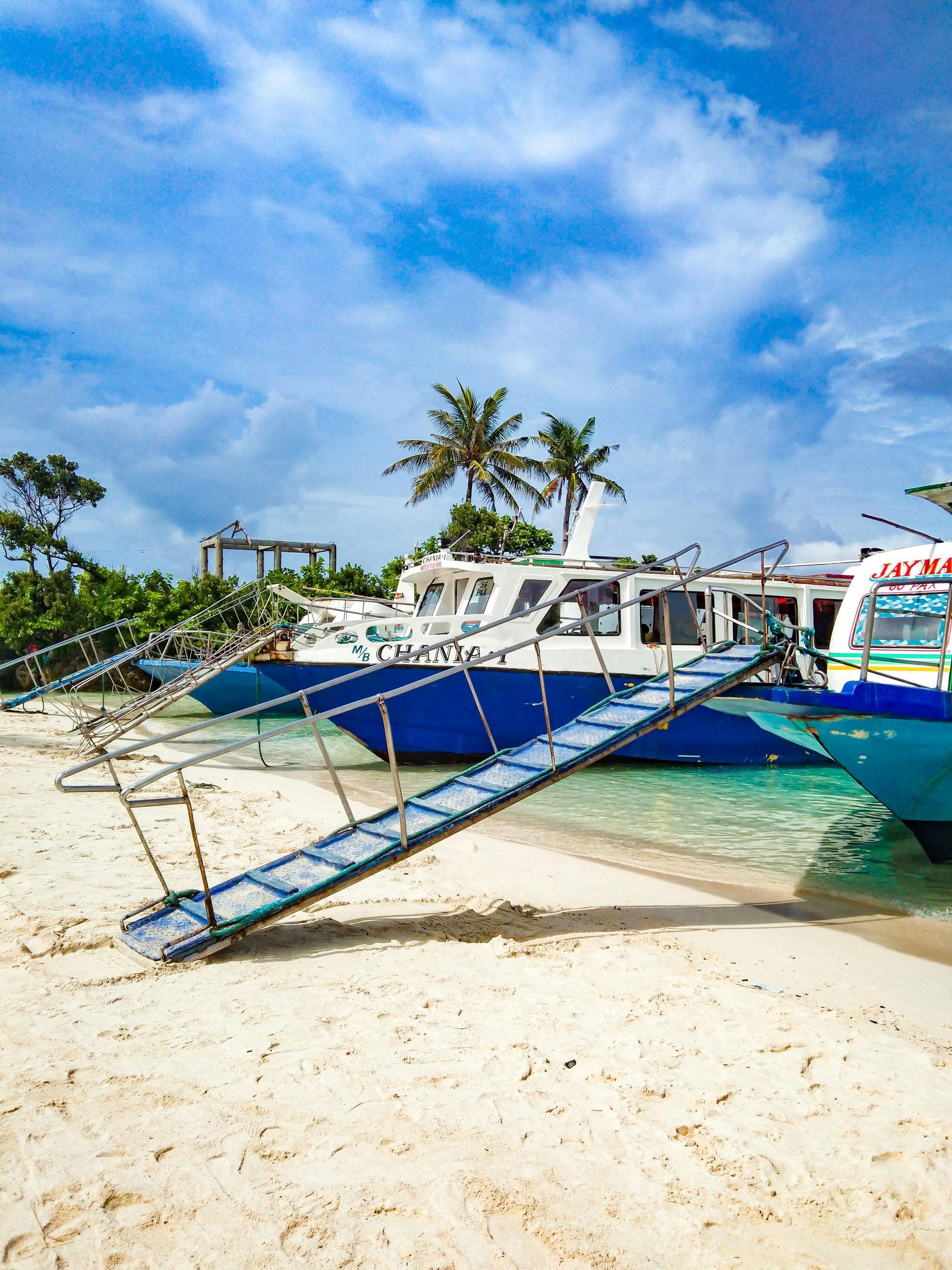 Passenger ferry arriving at Boracay port, providing transport to hotels in Boracay Station 2